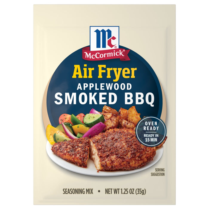 McCormick Air Fryer Applewood Smoked BBQ seasoning mix package with a serving suggestion of chicken and potatoes.