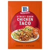 McCormick Mexican Style Street Corn Taco seasoning mix package with a serving suggestion of tacos on a white plate.