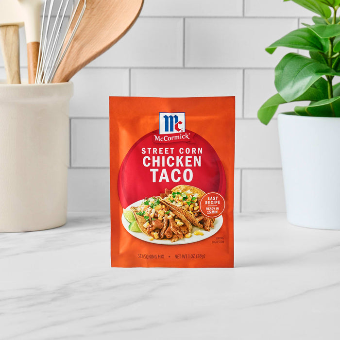 A packet of McCormick Street Style Chicken Taco seasoning mix is displayed on a countertop.