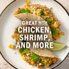 Two tacos filled with corn and cilantro, suggesting they pair well with chicken, shrimp, and other ingredients.
