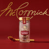 A jar of McCormick Saffron is displayed against a red background with the McCormick logo in gold.