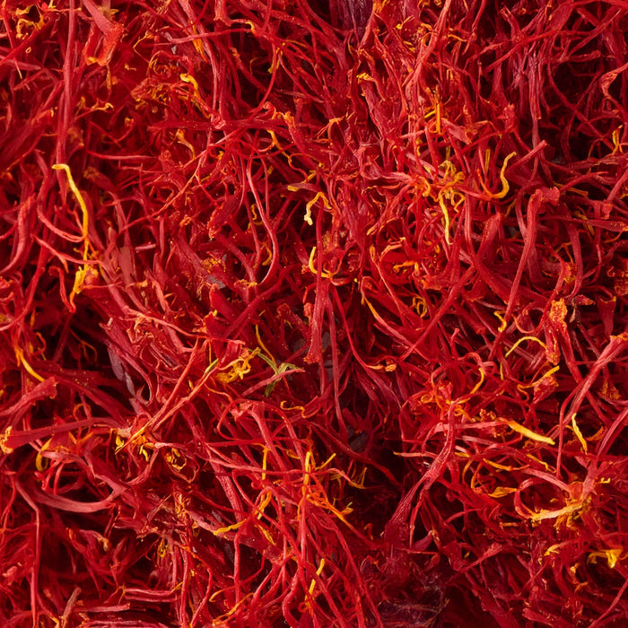 A close-up view of vibrant red saffron threads.