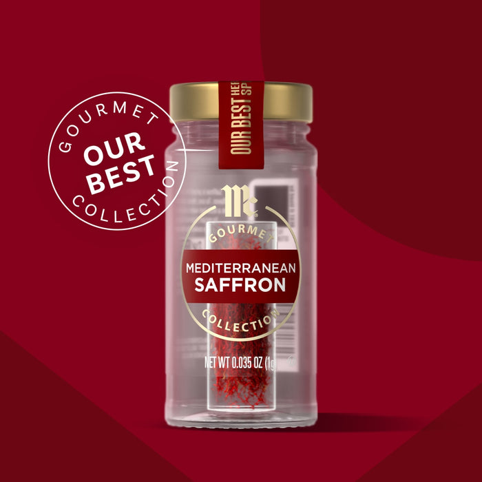 A clear jar of Mccormick Gourmet Saffron 0.035 Oz, part of the Our Best Collection, contains vibrant red saffron threads and is topped with a gold cap, set against a rich red background.