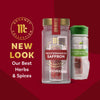 An advertisement showcasing the new packaging for Mccormick Gourmet Saffron 0.035 Oz, with a modern clear jar on the left and the previous green-capped jar on the right, against a red background with text 'NEW LOOK Our Best Herbs &amp; Spices'.