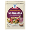 McCormick Shawarma Pita Seasoning &amp; Sauce Duo with Garlic Sauce package with a serving suggestion of a pita with chicken, tomatoes, onions, and cucumber.