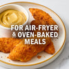 A plate of crispy chicken tenders with a side of dipping sauce, perfect for air-fryer and oven-baked meals.