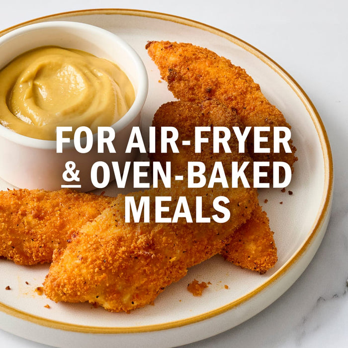 A plate of crispy chicken tenders with a side of dipping sauce, perfect for air-fryer and oven-baked meals.