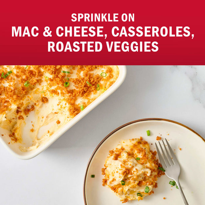 A casserole dish and a plate of mac and cheese topped with a crunchy sprinkle, suggesting it can also be used on casseroles and roasted vegetables.