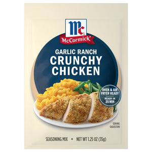 McCormick Garlic Ranch Crunchy Chicken seasoning mix package with a serving suggestion of chicken, mac and cheese, and zucchini.