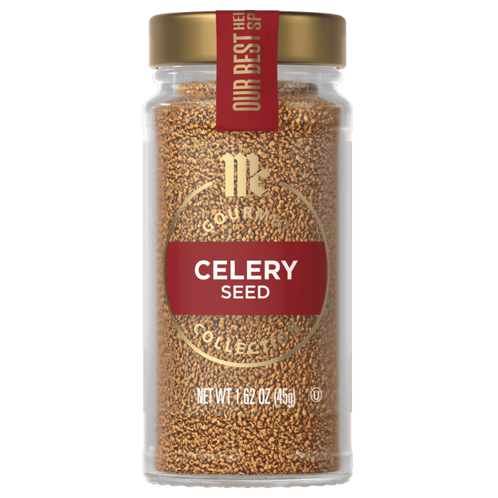 A glass jar of McCormick Gourmet Celery Seed.