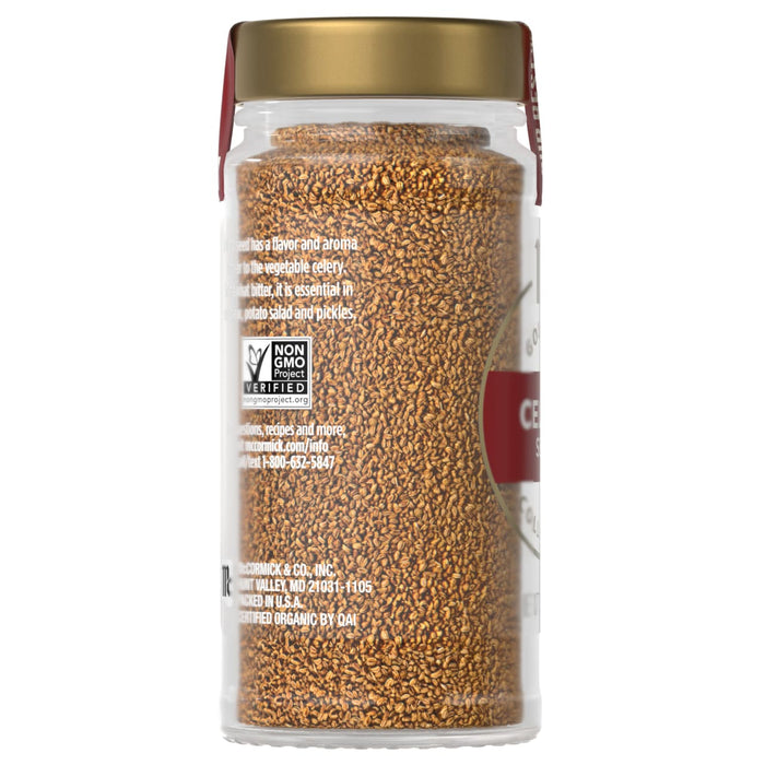 A glass jar of McCormick Gourmet Celery Seed.