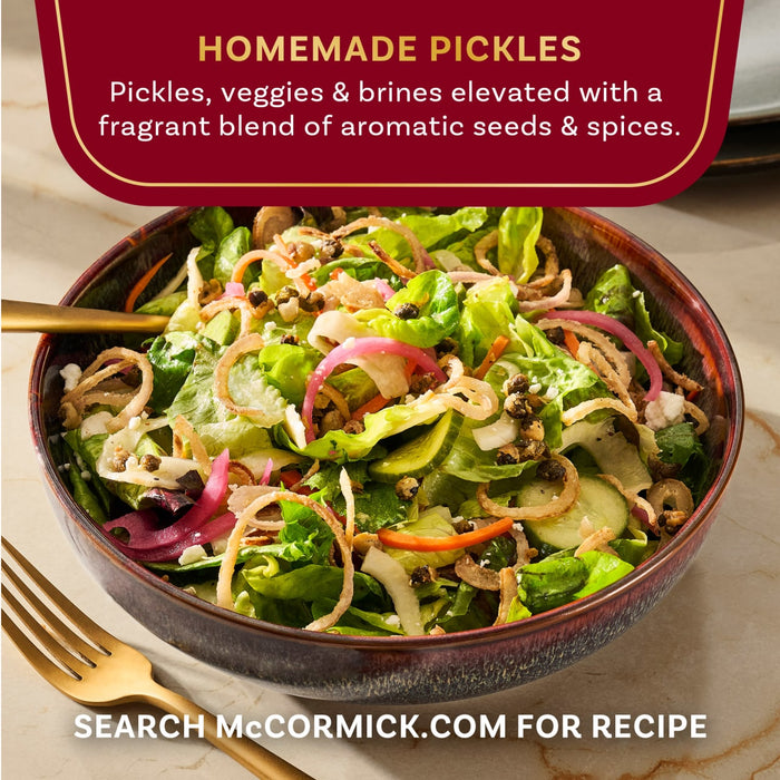 A bowl of homemade pickles from McCormick is shown, featuring pickles, vegetables, and brines elevated with a fragrant blend of aromatic seeds and spices.