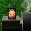 ['A packet of McCormick Grill Mates Hawaiian Style BBQ marinade mix sits on a grill.']