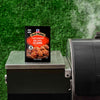 A package of McCormick Grill Mates Asian BBQ 15 Minute Marinade Mix sits on a grill.