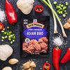 This is a product shot of McCormick Grill Mates Asian BBQ 15 Minute Marinade Mix surrounded by ingredients like garlic peppers and green onions.