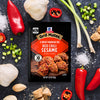 This is a product shot of McCormick Grill Mates Asian BBQ 15 Minute Marinade Mix surrounded by ingredients like garlic, peppers, and green onions.