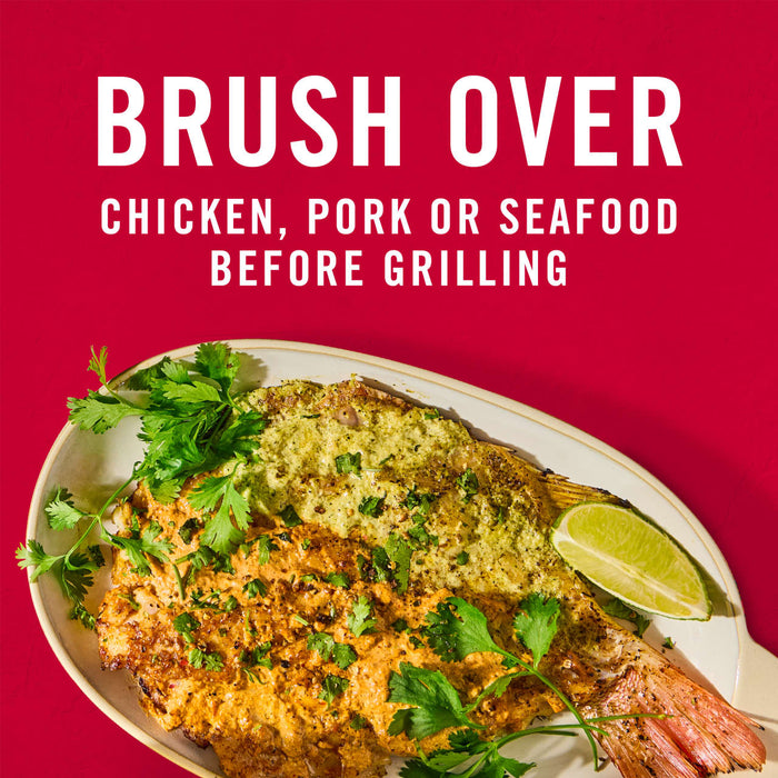 A plate of grilled fish with a green sauce and cilantro with the text Brush over chicken pork or seafood before grilling above it.
