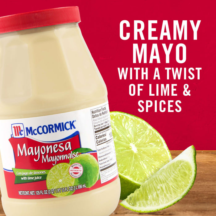 ['A jar of McCormick Mayonesa with lime juice, next to a lime wedge.']