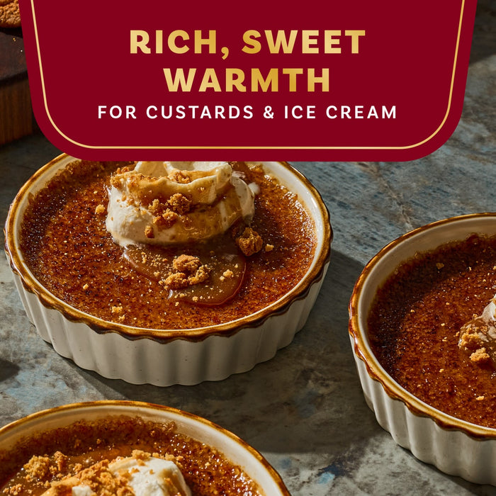 A close-up of crème brûlée desserts topped with ice cream, highlighting the product's rich, sweet warmth for custards and ice cream.