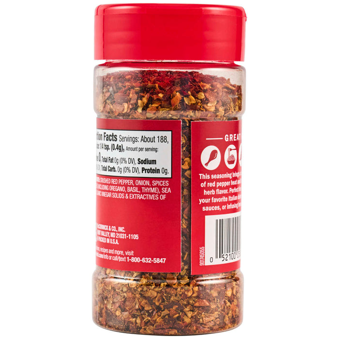 ['A bottle of McCormick Crushed Red Pepper seasoning.']
