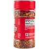 ['A bottle of McCormick Crushed Red Pepper and Herb Seasoning.']