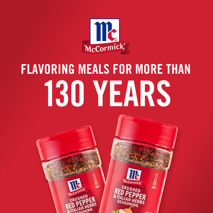 ['Two McCormick Crushed Red Pepper &amp; Italian Herbs Seasoning bottles on a red background.']