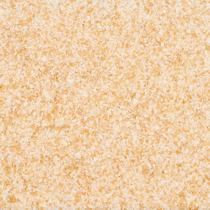 A close-up texture shot of Mccormick Brown Butter Salt Finishing 4.12 Oz.