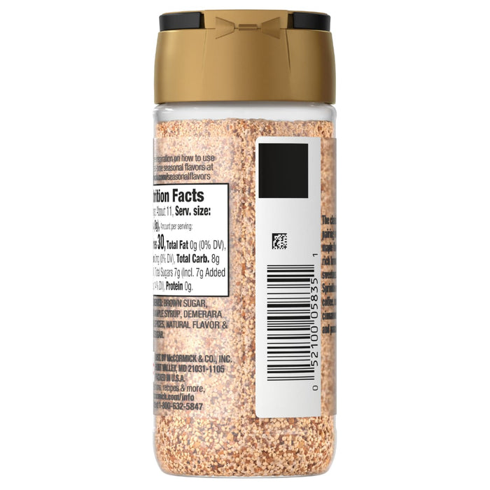 A bottle of McCormick seasoning with a gold lid and a nutrition facts label.