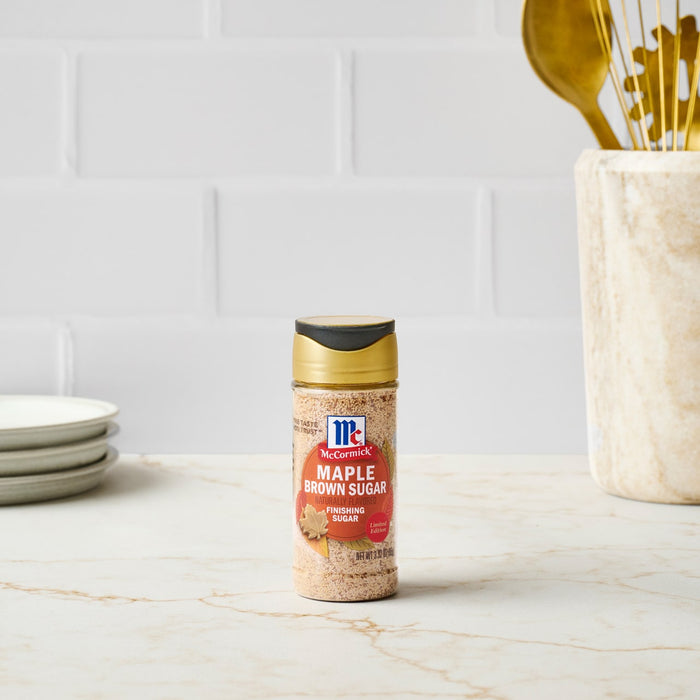 A bottle of McCormick Maple Flavored Extract stands on a countertop.