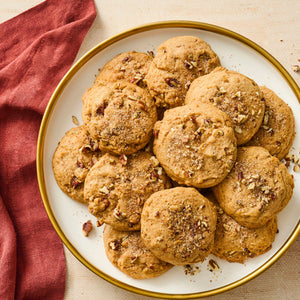 Plate of cookies on a white plate with a red cloth in the background