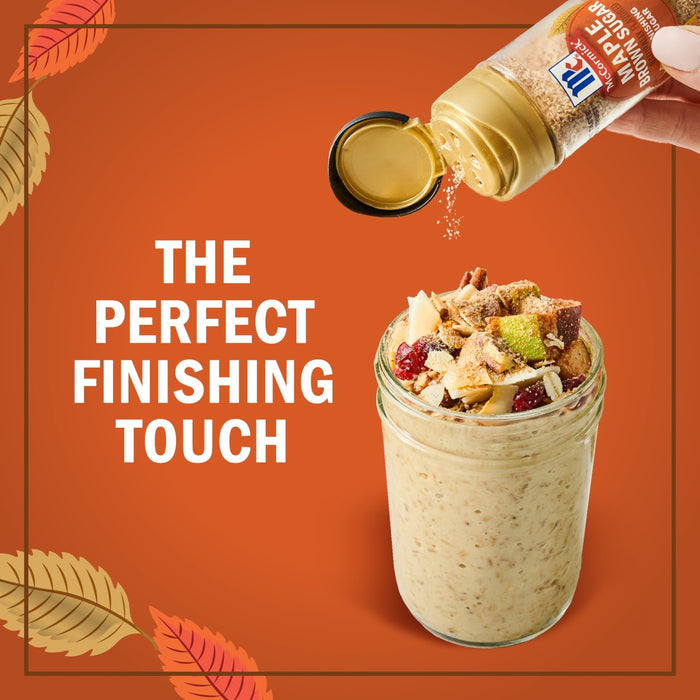 A hand sprinkles McCormick Pumpkin Pie Spice onto a jar filled with a fall-themed dessert, highlighting it as the perfect finishing touch.