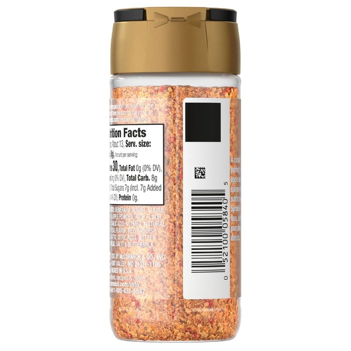 A bottle of McCormick seasoning with a gold lid and a nutrition facts label.