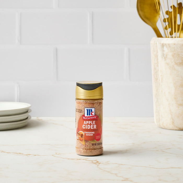 A bottle of McCormick Grill Mates Montreal Steak Seasoning sits on a kitchen counter.