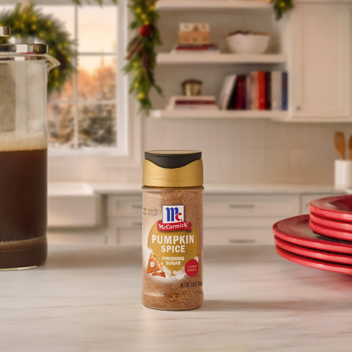 A bottle of McCormick Paprika spice sits on a kitchen counter.