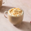 Two mugs of pumpkin spice lattes with McCormick Pumpkin Spice seasoning and pumpkin puree are displayed, suggesting a cozy autumn beverage.