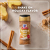 A sprinkle of Kernel Season's Caramel Popcorn Seasoning is being added to a bowl of caramel popcorn, highlighting it as the perfect finishing touch.