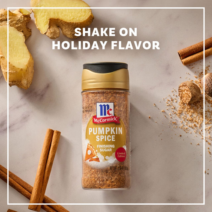 A sprinkle of Kernel Season's Caramel Popcorn Seasoning is being added to a bowl of caramel popcorn, highlighting it as the perfect finishing touch.