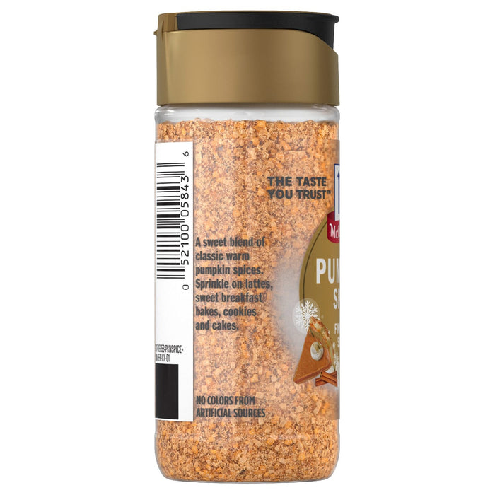 A side view of a clear bottle containing Mccormick Pumpkin Spice Finishing Sugar Edible Cake Decoration 3.66 Oz featuring a sweet blend of classic warm pumpkin spices and no colors from artificial sources.