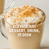 A latte with a frothy topping and sprinkled with brown sugar, suggesting it can elevate any dessert, drink, or dish.