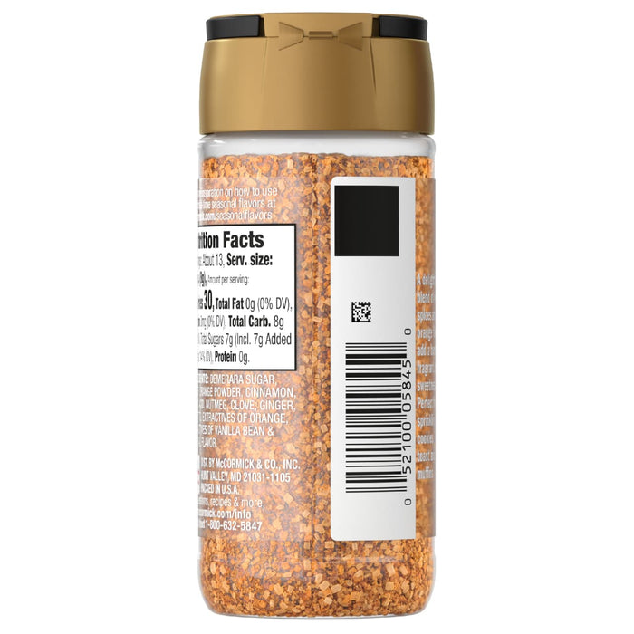 A bottle of McCormick seasoning with a gold lid and a nutrition facts label.
