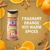 McCormick Spiced Orange seasoning is displayed amidst orange slices and cinnamon sticks, highlighting its fragrant orange flavor with warm spices.