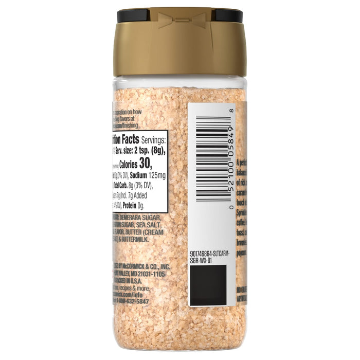 A clear plastic shaker bottle of Mccormick Salted Caramel Finishing Sugar Edible Cake Decoration 3.81 Oz, displaying its nutrition facts, ingredients like demerara sugar and sea salt, and a gold lid.