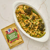 A prepared McCormick Green Bean Casserole mix is displayed next to a casserole dish filled with the finished dish.