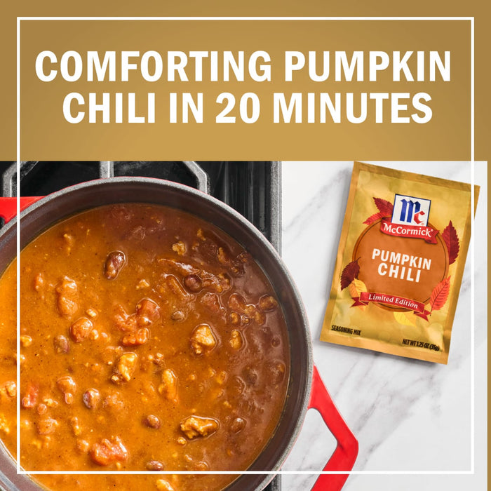 A pot of comforting pumpkin chili is shown next to a packet of McCormick Pumpkin Chili seasoning.