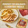A plate of sliced turkey and mashed potatoes covered in McCormick Brown Gravy, perfect for holidays and everyday meals.