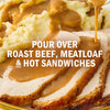 A close-up of sliced roast beef and mashed potatoes covered in gravy, suggesting it can be poured over roast beef, meatloaf, and hot sandwiches.
