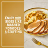 A plate of sliced turkey and mashed potatoes with gravy, suggesting it can be enjoyed with sides like mashed potatoes and stuffing.
