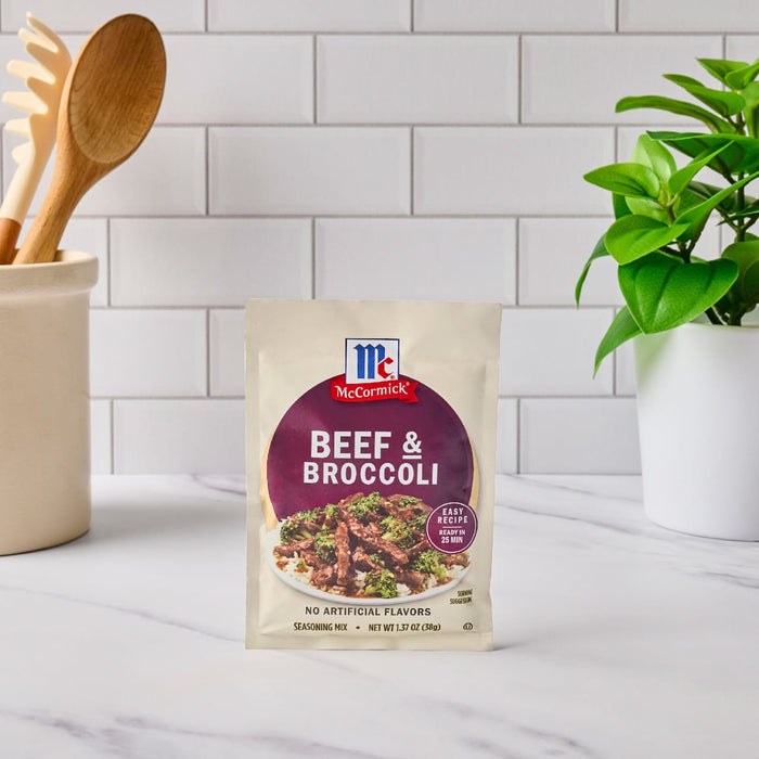 A McCormick Beef &amp; Broccoli seasoning mix packet sits on a kitchen counter.