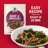 A McCormick Beef &amp; Broccoli seasoning packet is displayed next to a pan of beef and broccoli highlighting the easy recipe that is ready in 25 minutes.