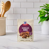 A packet of McCormick Korean BBQ seasoning mix is displayed on a kitchen counter.